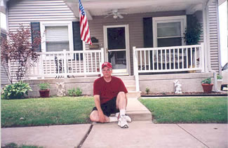 Stew Thornley in front of Yogi Berra's boyhood home