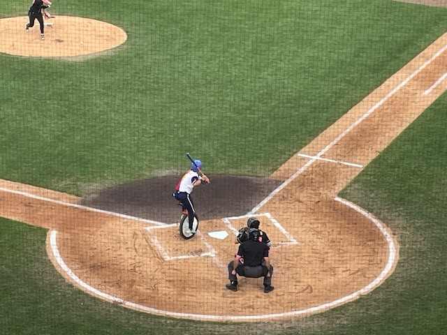 Jonathan Luders of the Tailgaters batting on a unicycle